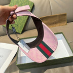 Pink visor cap interior with brown underside and adjustable buckle strap