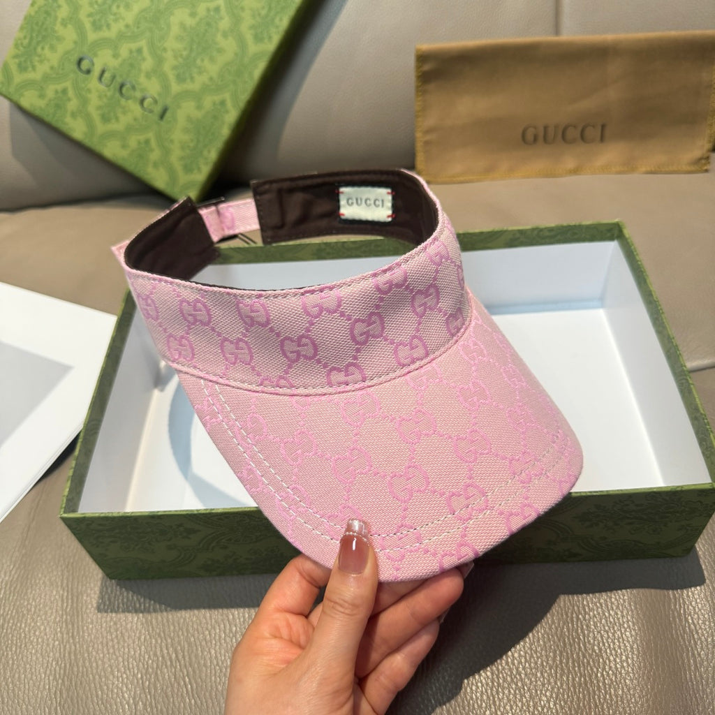 Pink GG-pattern visor cap with brown underbrim and green-red stripe detail