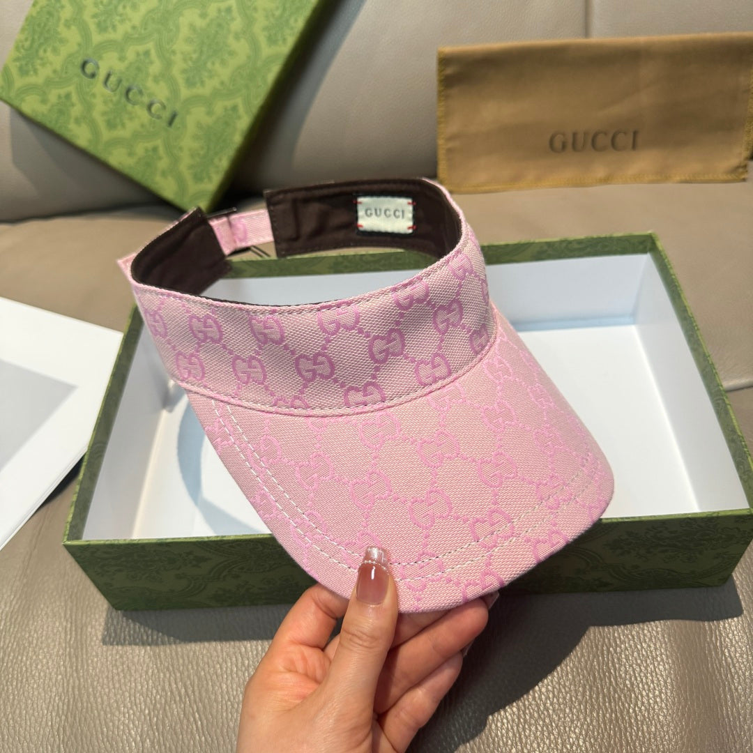 Pink GG-pattern visor cap with brown underbrim and green-red stripe detail