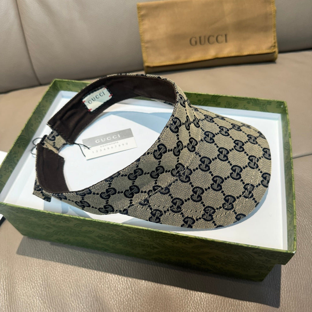 Gucci cap with beige GG canvas and dark interior brim, shown on box