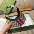 Gucci cap with beige GG canvas and red-and-navy stripe, dark brim underside