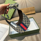 Gucci cap with beige GG canvas strap and red-and-navy stripe, side view