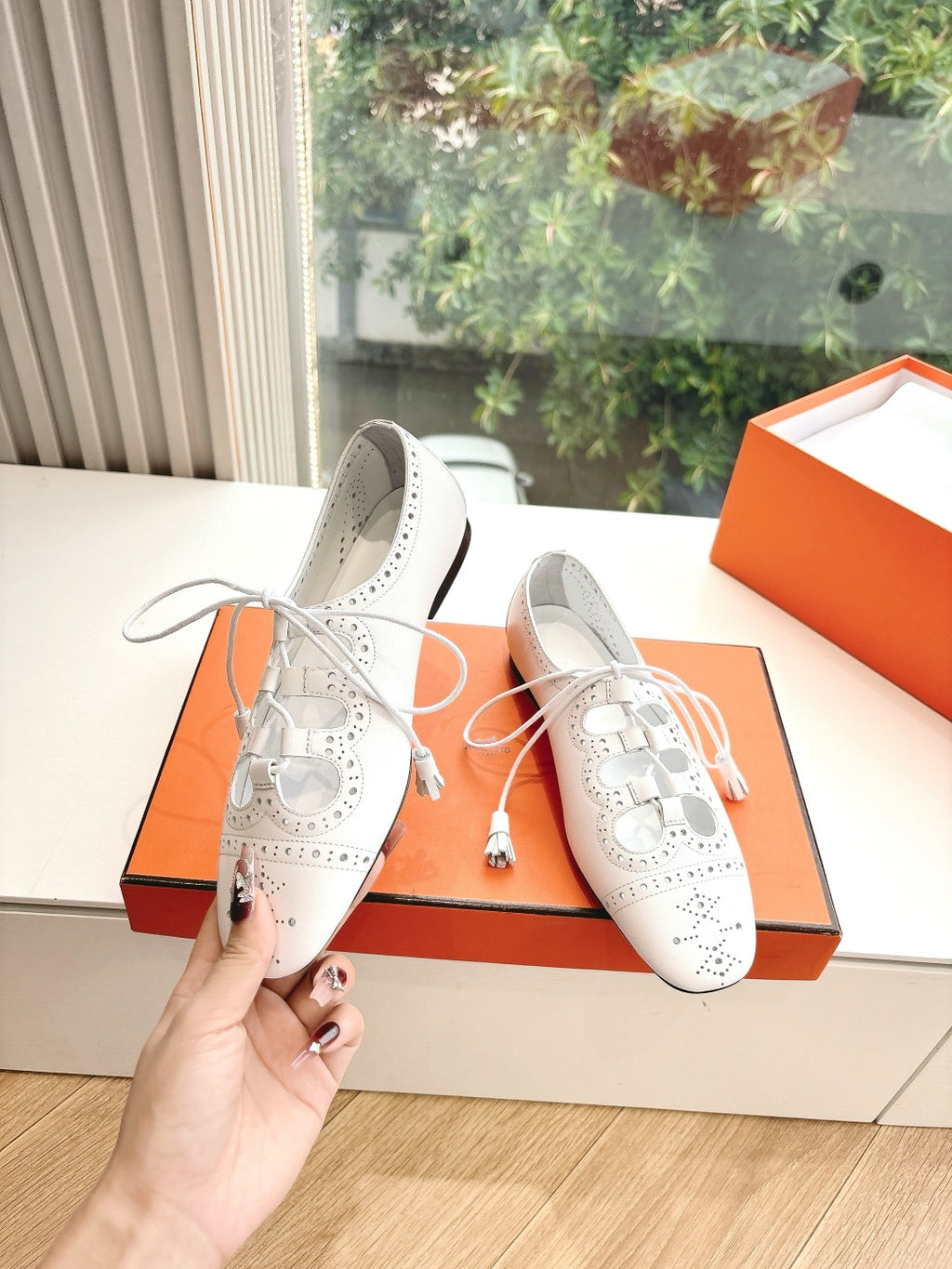 Hermes ladies white lace-up shoes with perforated design and black rubber heel sole