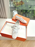 Hermes ladies white lace-up oxford shoes with perforated panels and black rubber sole