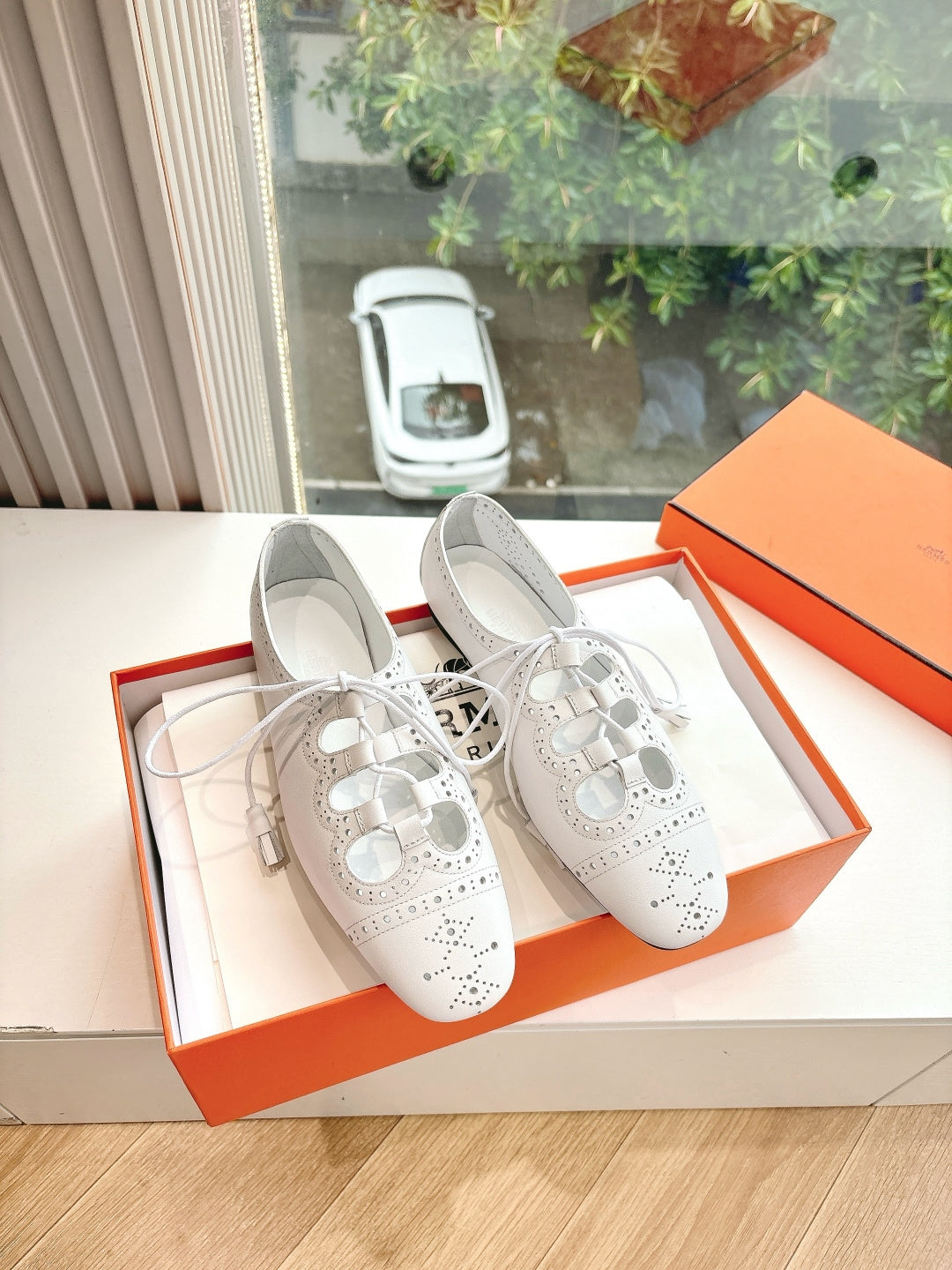 Hermes ladies white perforated lace-up shoes with black sole and detailed brogue styling