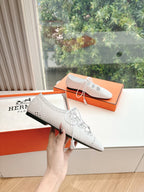Hermes ladies white leather lace-up shoes with brogue perforations and black sole