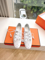 Hermes ladies white lace-up oxford shoes with perforated toe and black sole