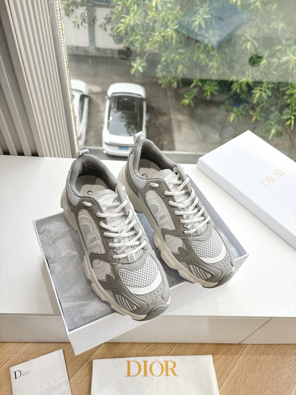 Women’s lace-up sneakers in light gray with white mesh panels and chunky sole