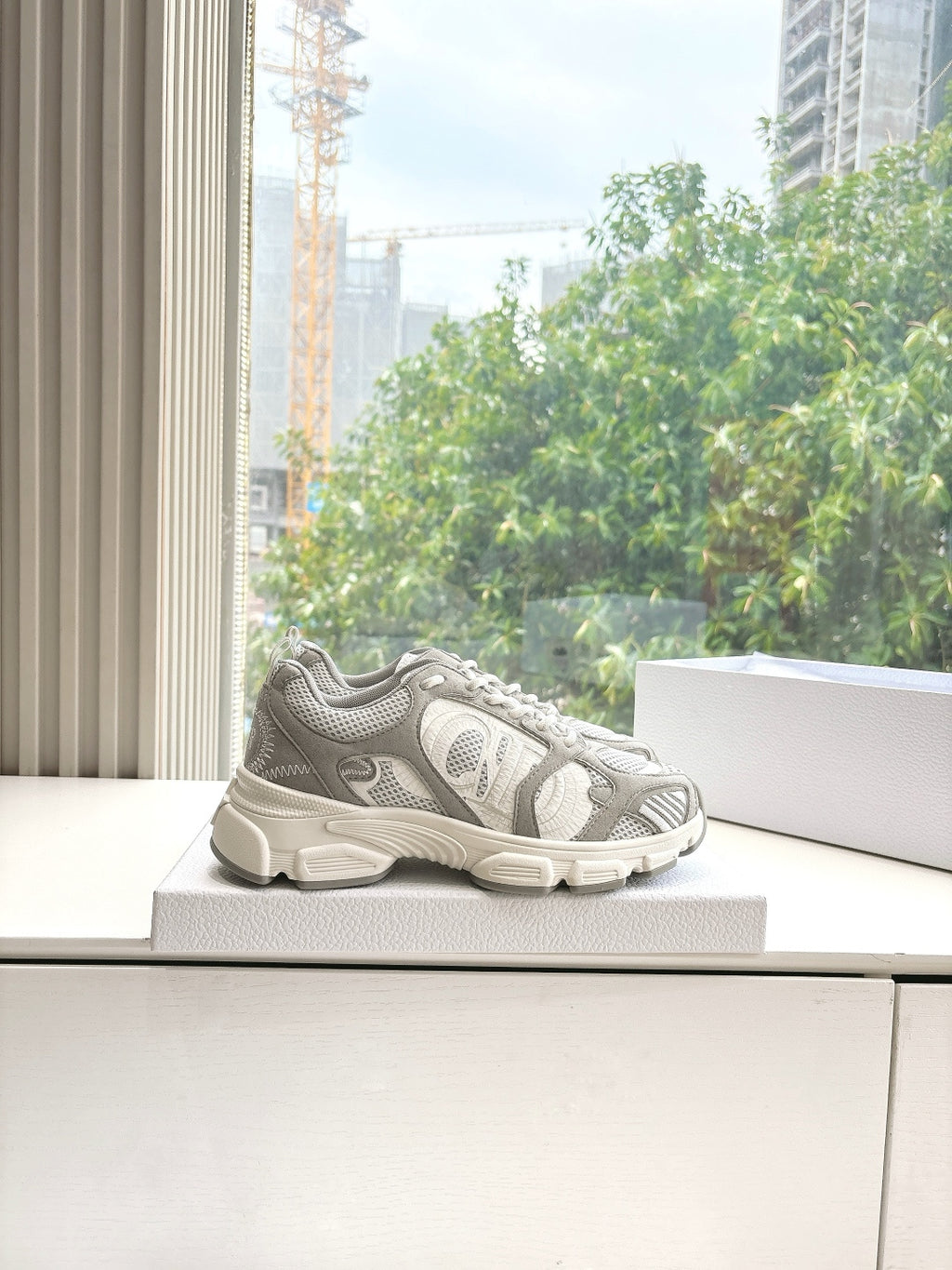 Women’s lace-up sneakers on a platform, light gray and white with sporty tread