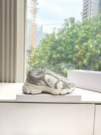 Women’s lace-up sneakers on a platform, light gray and white with sporty tread