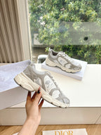 Women’s lace-up sneakers shown side by side in light gray and white, chunky sole