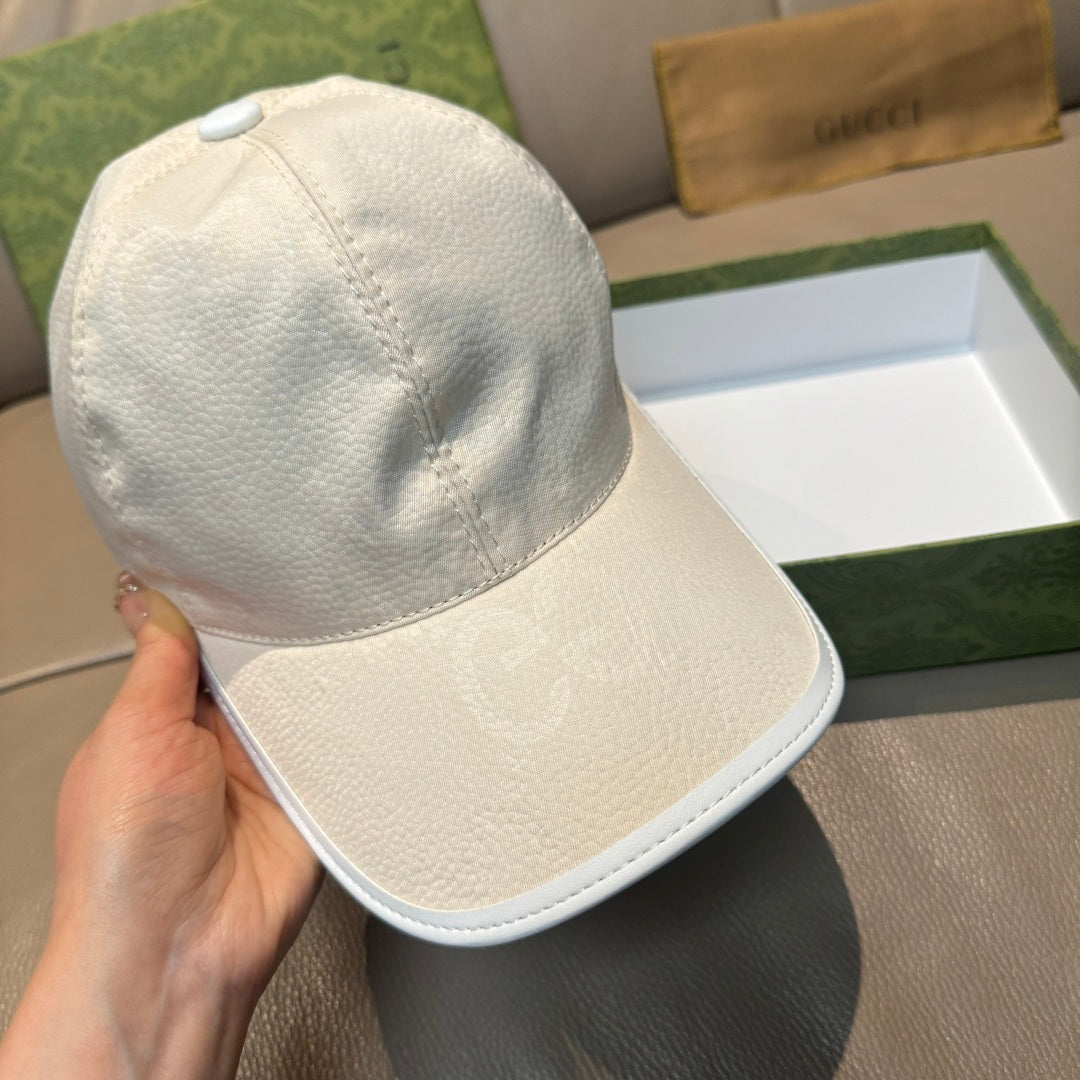 White leather baseball cap with curved brim, close side view