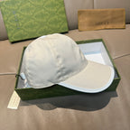 White leather baseball cap with curved brim and stitched crown