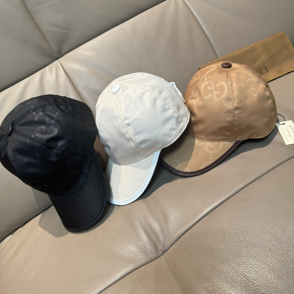 Set of three leather baseball caps: black, white, and tan with curved brims