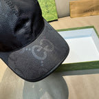 Gucci cap close-up of dark monogram brim with curved edge stitching