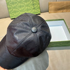 Gucci cap in dark leather-look, circular crown button and curved brim