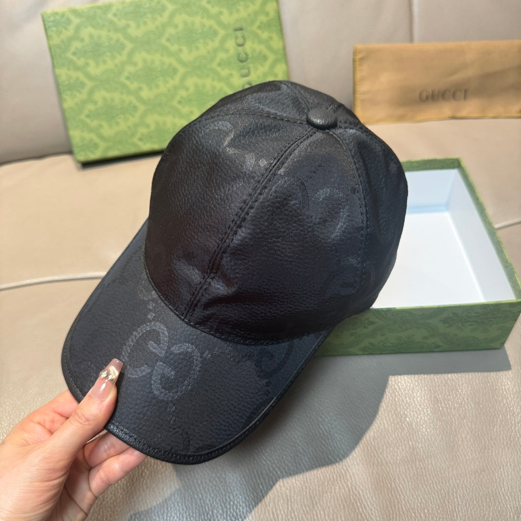 Gucci cap in dark monogram leather-look, side profile with curved brim