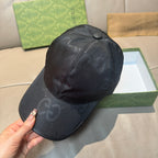 Gucci cap in dark monogram leather-look, side profile with curved brim
