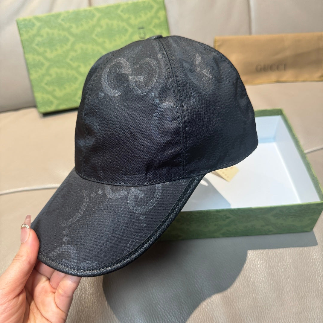 Gucci cap in dark monogram leather-look, crown and curved brim view