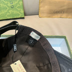 Gucci cap interior with black lining, size label, and adjustable strap tab