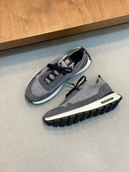 Givenchy sneakers with gray mesh upper, black laces, and chunky tread sole