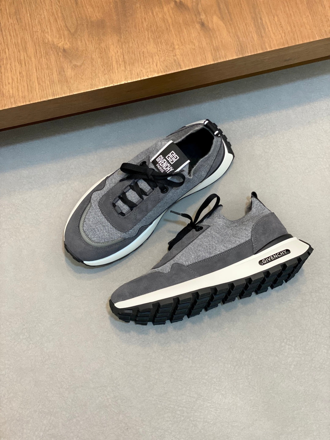 Givenchy sneakers with gray mesh upper, black laces, and chunky tread sole