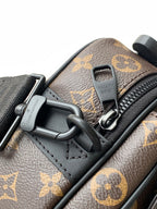 Louis Vuitton monogram bag close-up of black D-ring hardware and zipper pull