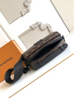 Louis Vuitton monogram crossbody bag with side zipper and adjustable strap, rear angle