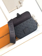 Louis Vuitton monogram crossbody bag in dark tone with adjustable strap and top flap detail