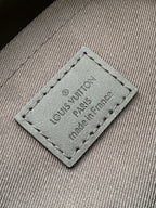 Louis Vuitton interior label patch reading 'Louis Vuitton Paris' and 'made in France'