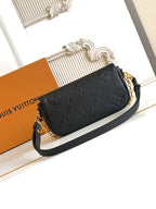 Black embossed leather crossbody bag with gold chain strap and front flap