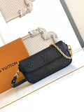 Black embossed leather flap shoulder bag with gold chain strap and front clasp