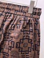 Patterned shorts waistband with elastic and navy-and-beige drawstring