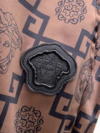 Beige shorts with navy medallion applique and black scalloped edge patch