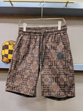 Logo-pattern shorts with elastic waistband and allover geometric Medusa print, tan and navy