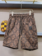 Logo-pattern shorts with elastic waistband and allover geometric Medusa print, tan and navy