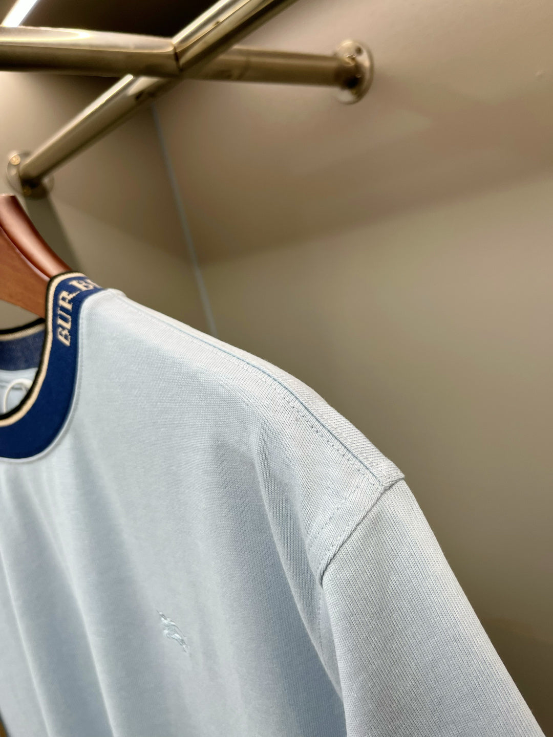 Burberry light blue T-shirt sleeve with small embroidered horse mark on side.