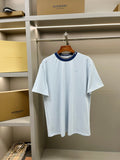Burberry light blue short-sleeve T-shirt with navy crew neck trim and small chest logo.