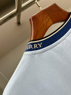 Burberry light blue T-shirt collar with navy trim and small logo text.