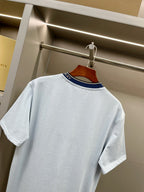 Burberry light blue T-shirt back with navy-striped collar trim.