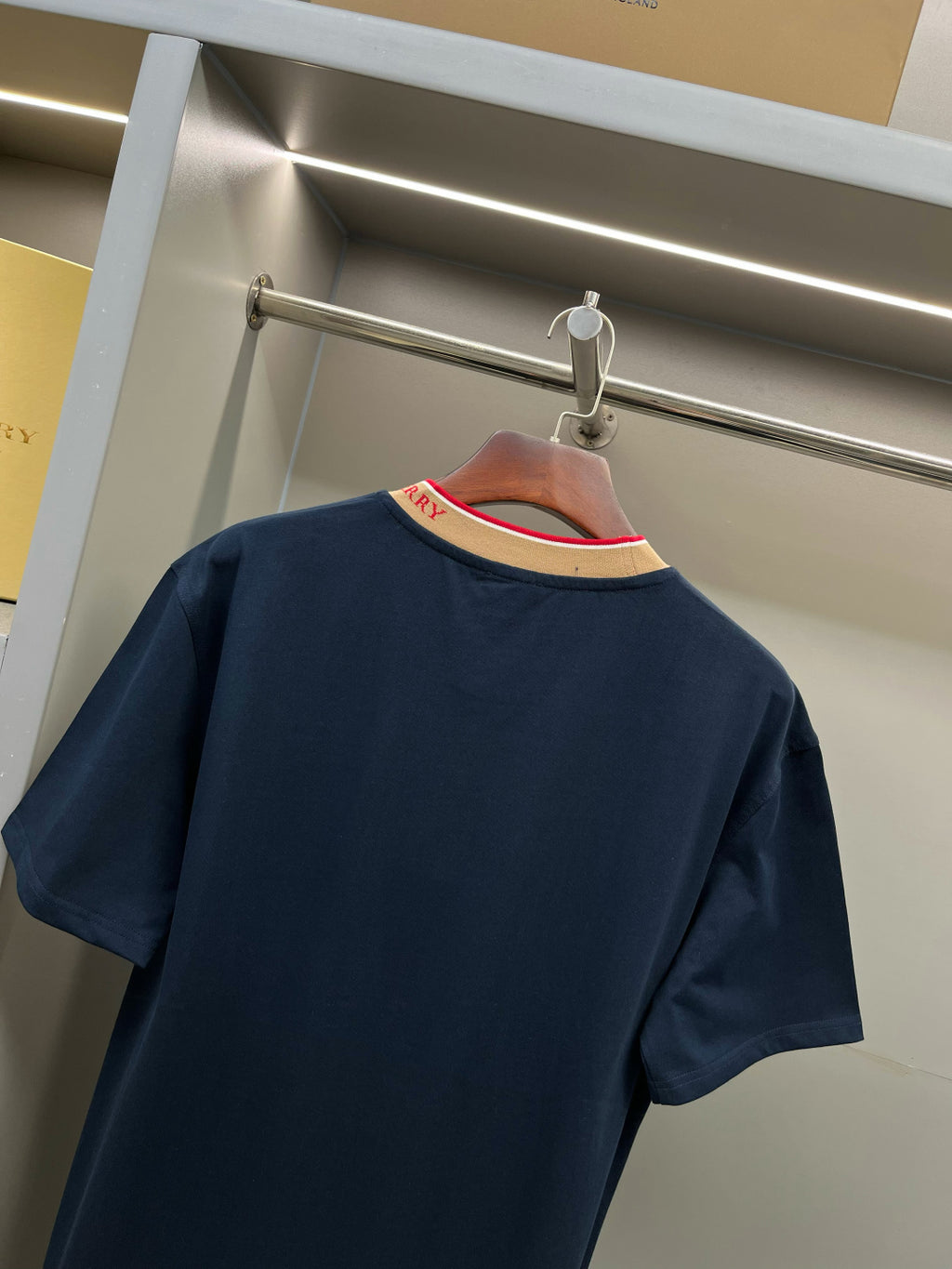 Burberry navy short-sleeve top back view with beige collar trim