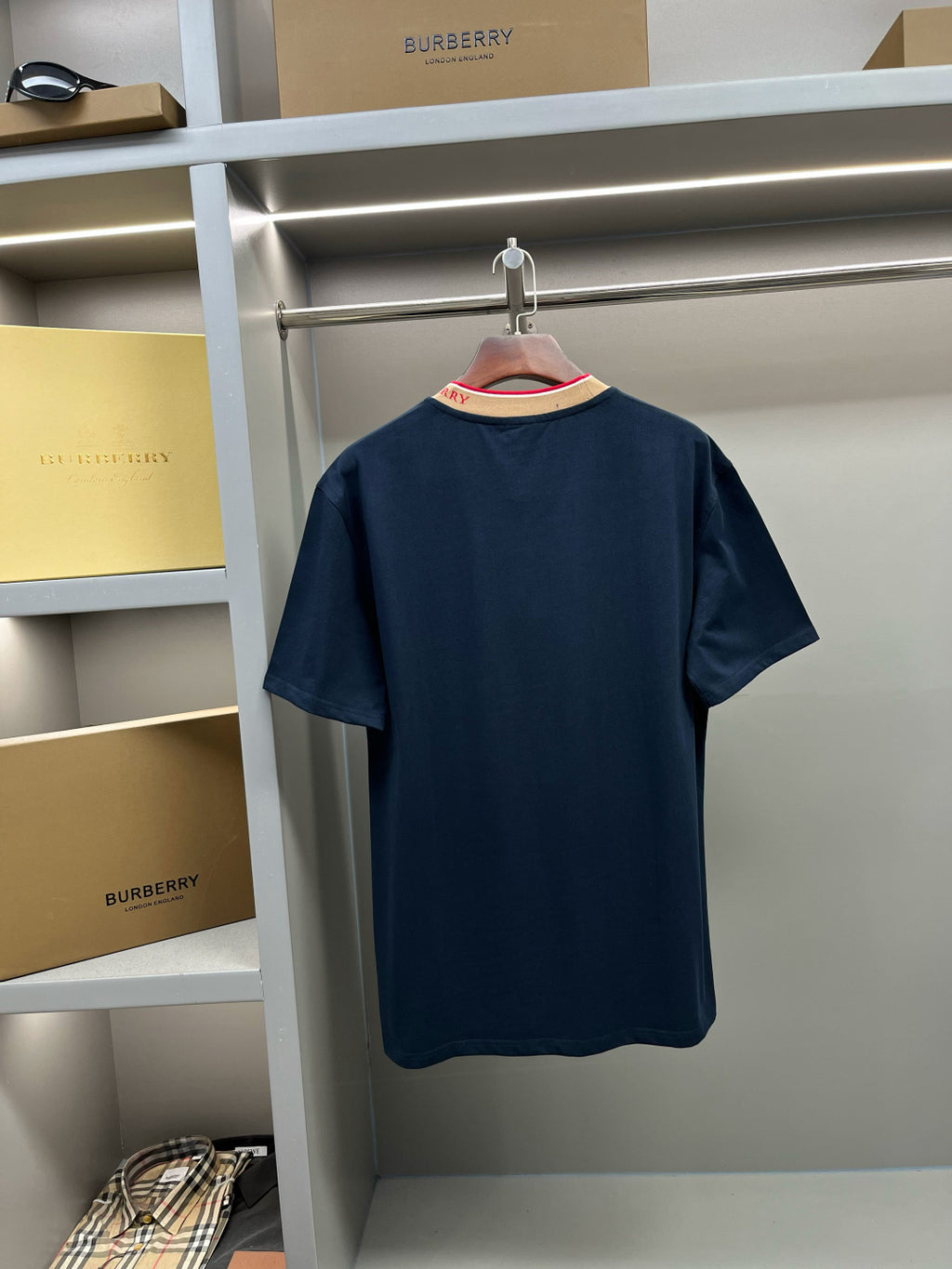 Navy Burberry T-shirt back view on hanger with crew neck