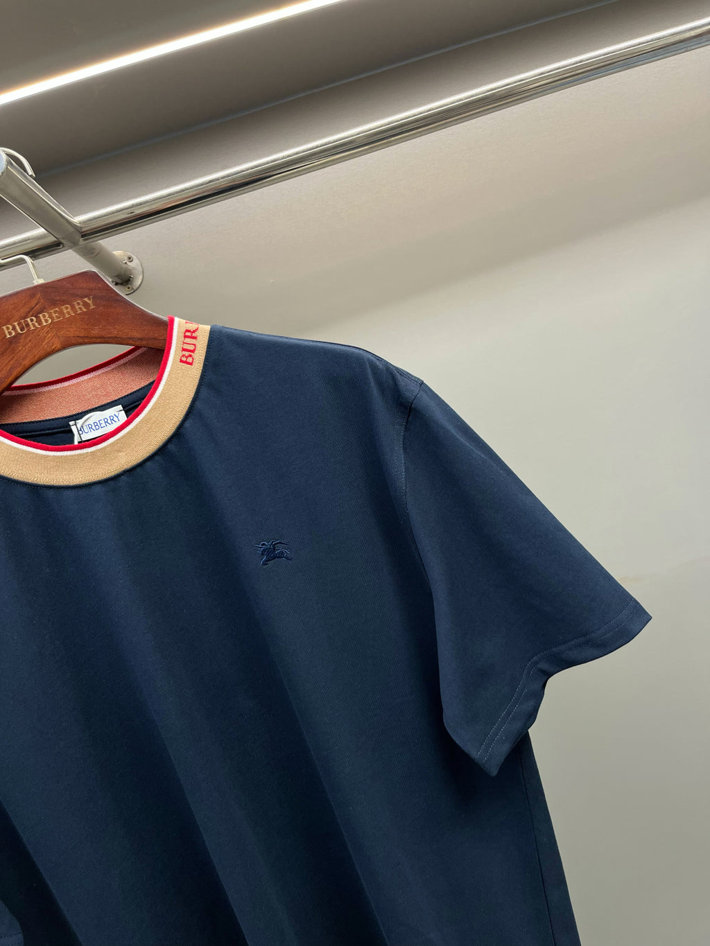 Navy Burberry T-shirt with crew neck and small left-chest logo; short sleeves