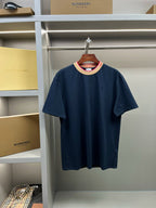 Navy Burberry T-shirt with crew neck, beige collar trim, and small chest logo