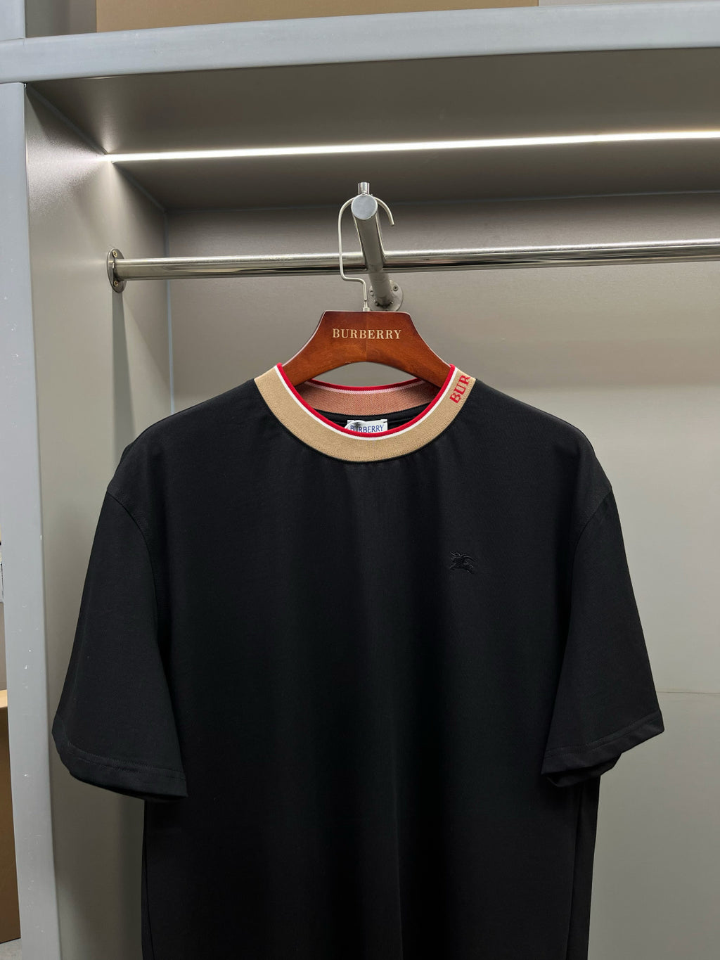 Burberry black short-sleeve crew-neck shirt with small chest logo and striped collar