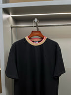 Burberry black short-sleeve crew-neck shirt with small chest logo and striped collar