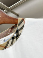 White T-shirt collar detail with Burberry check-pattern trim