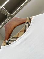White T-shirt neckline detail with Burberry check-pattern trim and inner label