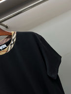 Burberry black short-sleeve T-shirt, angled view of side and shoulder