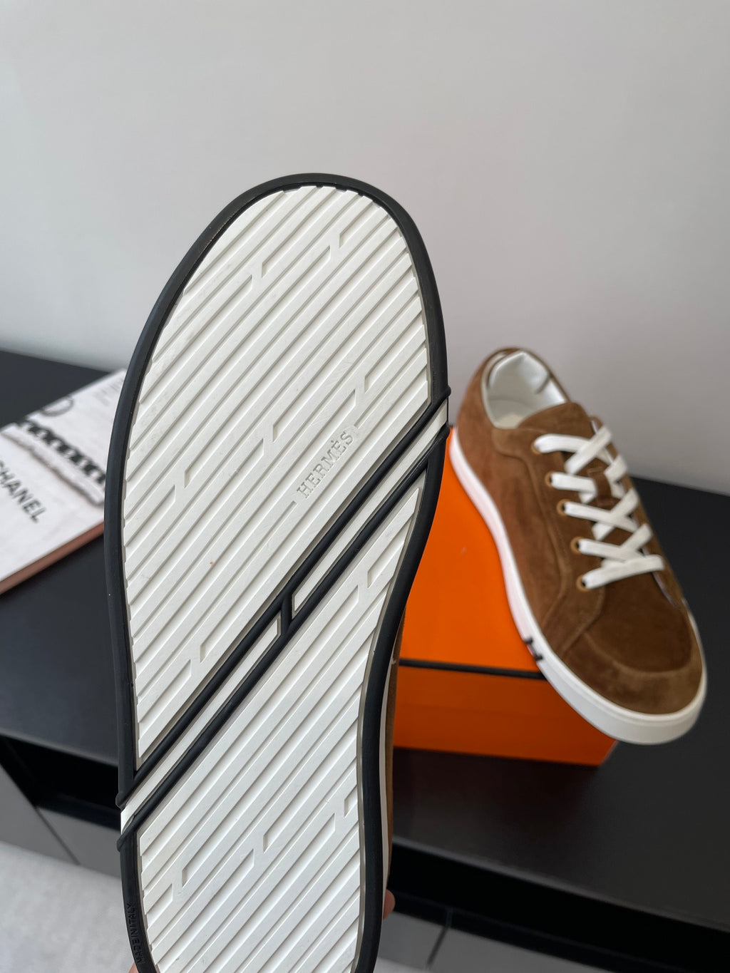 Hermes ladies suede sneaker outsole with ridged tread on white rubber sole